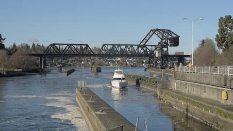 Boat coming into ballard locks winter seattle washington Stock Footage 83425007