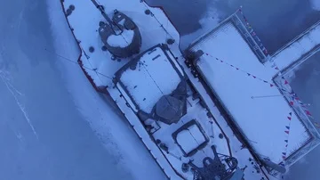 The boat is covered with snow in the ice Stock Footage 85575405