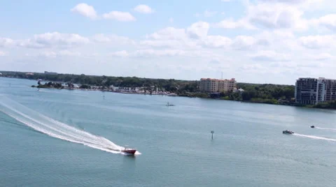 Boat creating wake through harbor in Clearwater Beach, FL Video stock 39885188