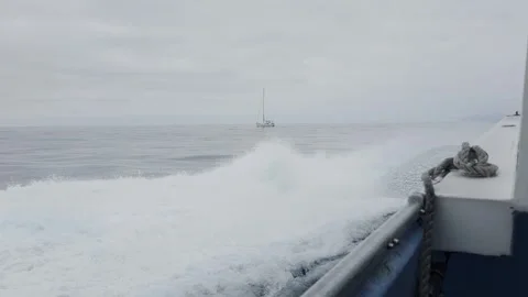 Boat Creating Waves on a Calm Ocean Stock Footage 323343886
