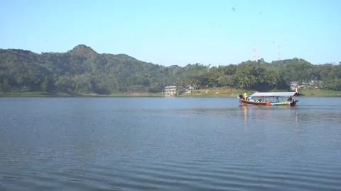 Boat Crossing the Artificial Lake Sermo Reservoir in Yogyakarta, Indonesia. Stock Footage 247547583