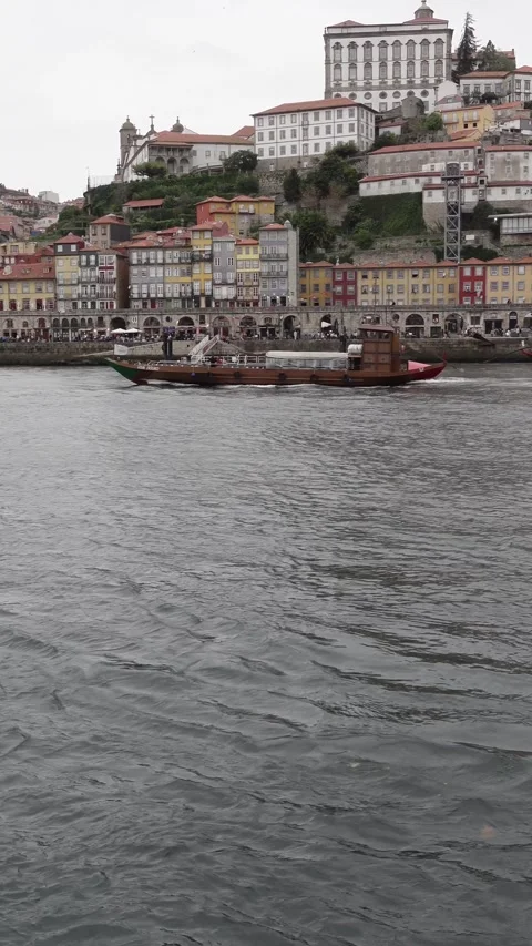 Boat Crossing the Douro River in Front of Porto, Portugal Stock Footage 301646640