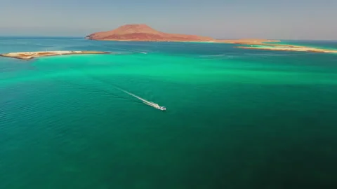 Boat cruising in pristine sea Stock Footage 341055129