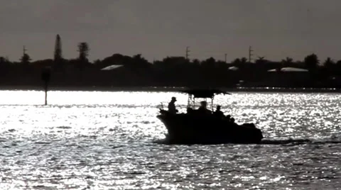 A boat cruising by the sunset Stock-Footage 39568419
