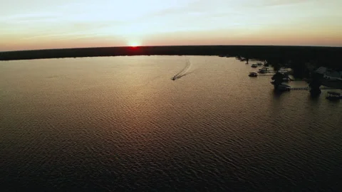 Boat cruising at sunset Stock Footage 162250362