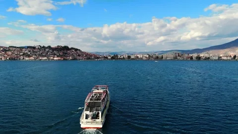 Boat On Crystal Clear Waters Floating Close To City Coast 스톡 동영상 274749453