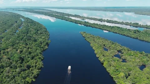 Boat Cutting Through Wide Amazon River at Midday Stock Footage 322127551