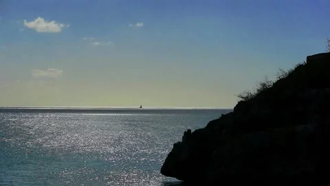 Boat in distance mountain in foreground Stock Footage 141018699
