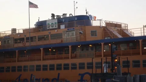Boat in dock with bird passing in slow motion seen from a window Stock Footage 136215129
