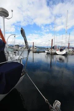 A boat dock with a Canada flag in the background. Stock Photos