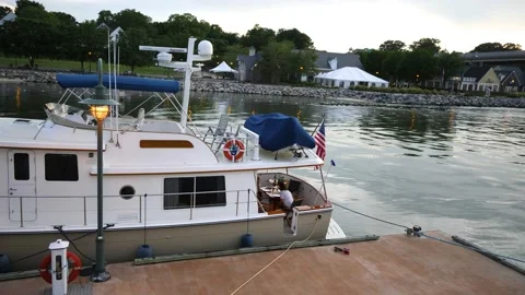 Boat at dock, rear deck set up for dinner at sunset Stock Footage 197478595