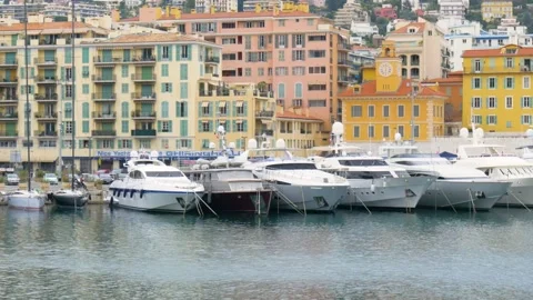 A boat is docked in front of a building Stock Footage 155586007