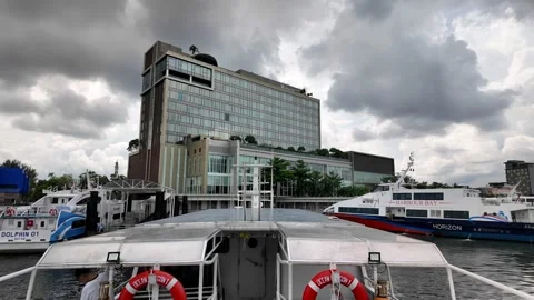 A boat is docked next to a building 스톡 동영상 318266725