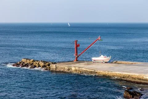 A boat is docked at a pier Stock Photos