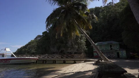 Boat docked on a remote Caribbean beach Stock Footage 137954784