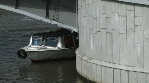 A boat docked under a bridge Stock Footage 84846482
