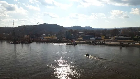 Boat Docking Small Town Riverside Sunny Drone Shot 4K Stock Footage 121103910