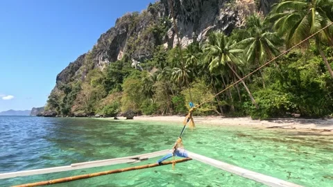 Boat Docking at Wild Deserted Island Shoreline in the Philippines Video stock 339978396