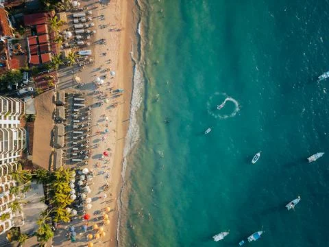 Boat doing circles in the ocean below near popular beach in Puerto Vallarta.. Stock Photos