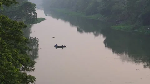 Boat Drifting Through Dense Forest Riverbanks Stock Footage 326149940