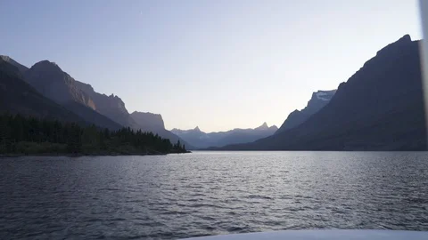 Boat Driving on Lake in Saint Mary Valley, HD Stock Footage
