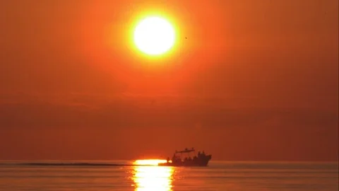 Boat Driving through Sunset on the Caribbean Sea Stock Footage 82878493