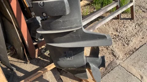 Boat engine propeller on outdoor ground, showing metal texture and mechanic.. Stock Footage 327291159