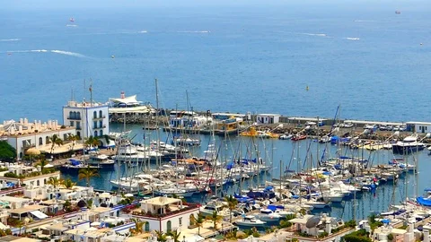Boat entering the harbour of Mogán Stock Footage 114583488