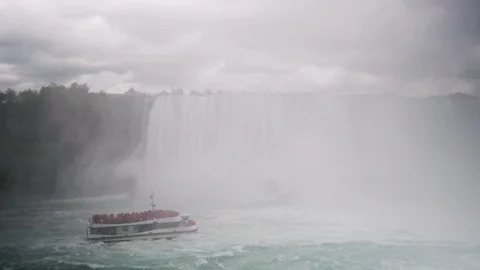 A Boat Fights the Current Under Niagara Falls Stock Footage 91734165