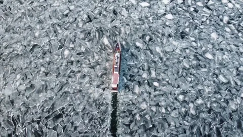 Boat float in frozen winter water landscape among ice shore. Boat Explore Stock Footage 323069165