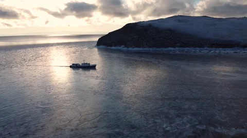 Boat float in frozen winter water landscape among ice shore. Boat Explore Stock Footage 323069170