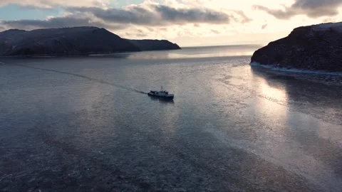 Boat float in frozen winter water landscape among ice shore. Boat Explore Video stock 323069185