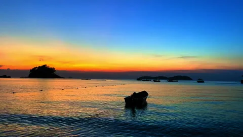 Boat float on sea, magic hour, Tioman Island, Malaysia, South East Asia, graded 스톡 동영상 243713825