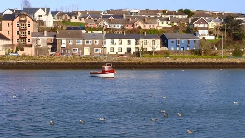 Boat  floating alone in changing light Stock Footage 129512166