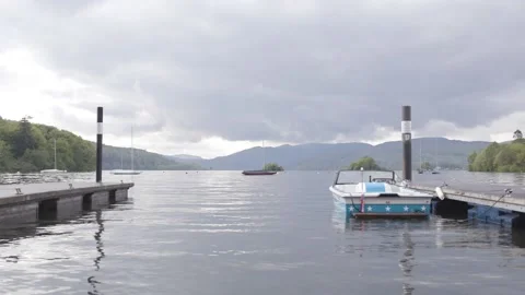 Boat floating in the dock of lake Windermere in the lake district Stock Footage 155225652