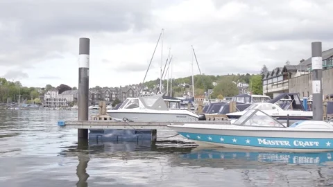 Boat floating in the dock of lake Windermere in the lake district Stock Footage 155225970