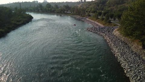 Boat floating down a river sunny aerial Stock Footage 345162205