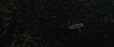 A boat is floating on the lake Stock Footage 141886123