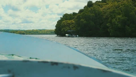 Boat floating on the lake, view from another boat Stock Footage 185688694
