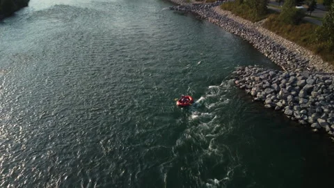 Boat floating over rapids down a river in sunny flyover aerial Vidéo 345161496