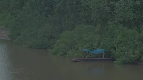 Boat Floating Peacefully on Amazon River Stock Footage 312768623