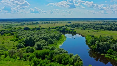 Boat is floating on the river. Drone flies  above a beautiful summer  landsca Stock Footage 136330357