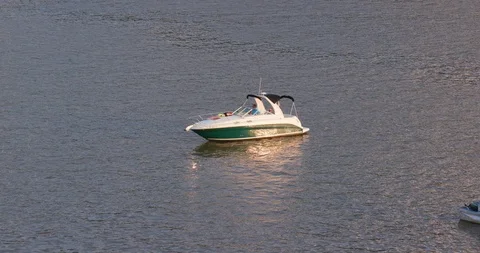 Boat Floating on River at Dusk Stock Footage 93423028