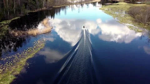 Boat floating on the river from a height Stock Footage 130381849