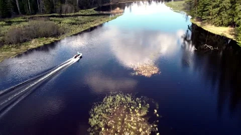 Boat floating on the river from a height Stock Footage 130381858