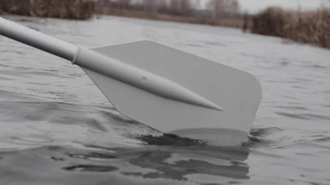 The boat is floating on the river, the paddle is lowered into the water Video stock 107070419