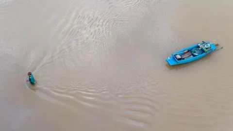 Boat floating in the river Stock Photos