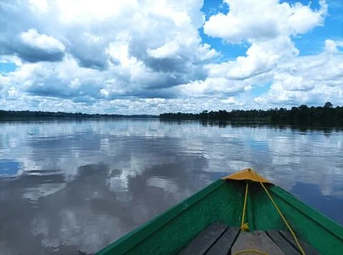 Boat floating on the river Stock Photos