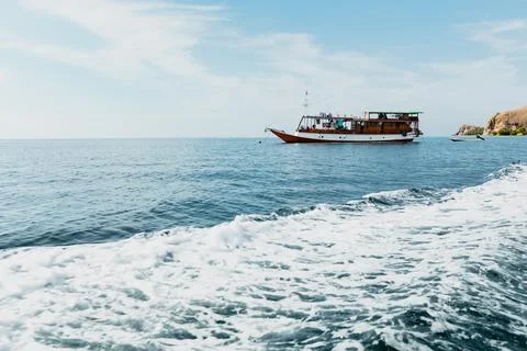 A boat floating on the surface of the water Foto stock