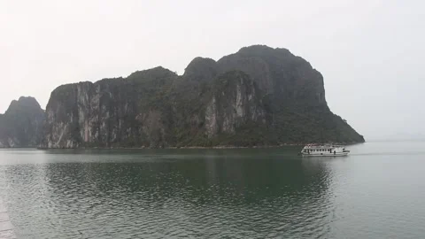 Boat floating through Halong bay Vietnam Stock Footage 251880613